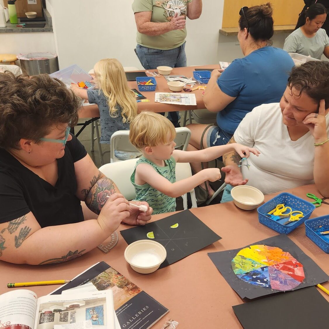 Family enjoying quality time during a monthly 1st Saturday Art Activity 